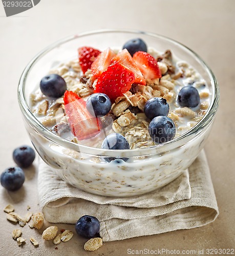 Image of healthy breakfast, bowl of muesli with milk