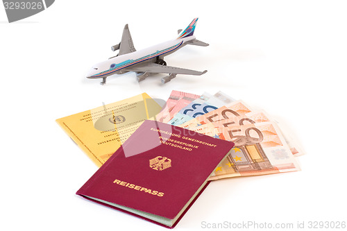 Image of Passport with money and vaccination card