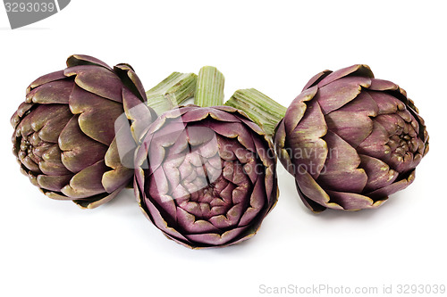 Image of Three artichokes on white background