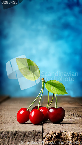 Image of Cherries on wooden table