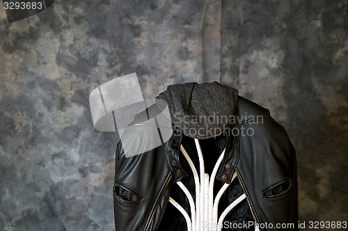 Image of leather jacket and cap