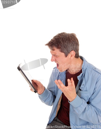 Image of Man shouting on his tablet.