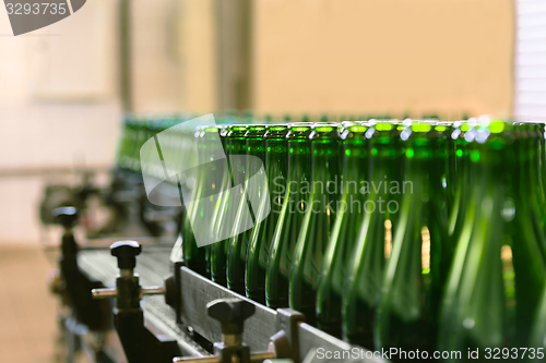 Image of Many bottles on conveyor belt