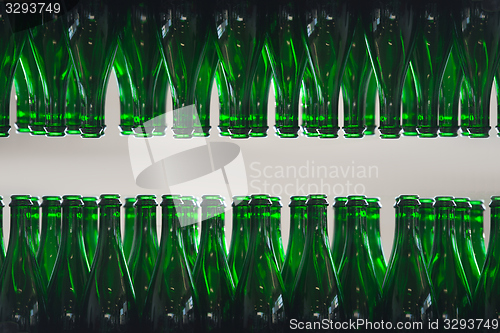 Image of Many bottles on conveyor belt