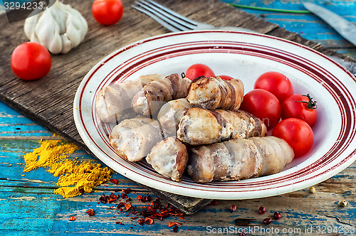 Image of set fried meat sausages on wooden background