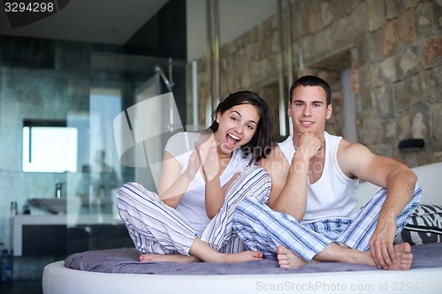 Image of couple relax and have fun in bed