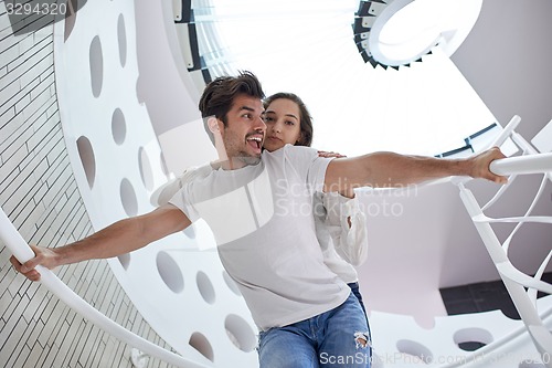 Image of relaxed yung couple at home  stairs