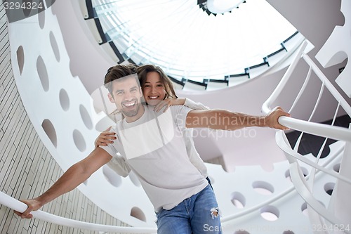 Image of relaxed yung couple at home  stairs