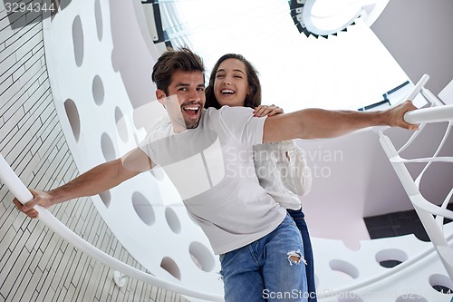 Image of relaxed yung couple at home  stairs