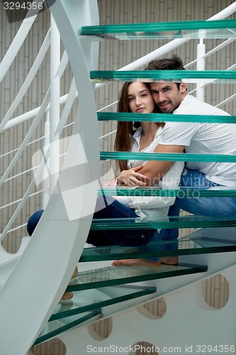 Image of relaxed yung couple at home  stairs