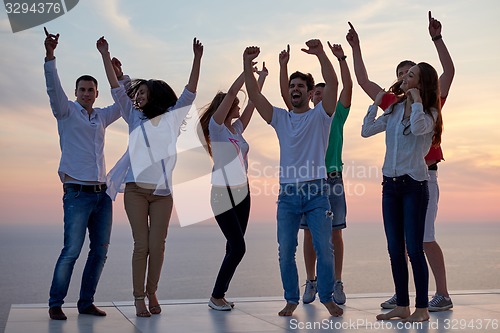 Image of party people  on sunset