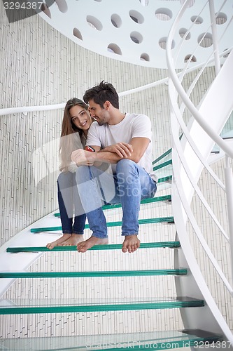 Image of relaxed yung couple at home  stairs