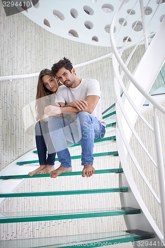 Image of relaxed yung couple at home  stairs