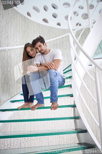 Image of relaxed yung couple at home  stairs