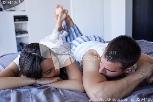 Image of couple relax and have fun in bed