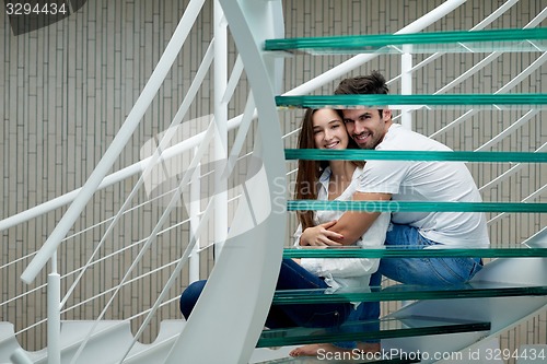 Image of relaxed yung couple at home  stairs