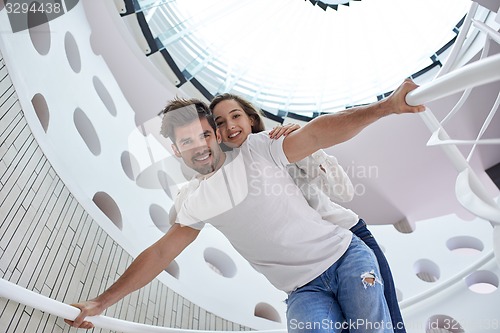 Image of relaxed yung couple at home  stairs