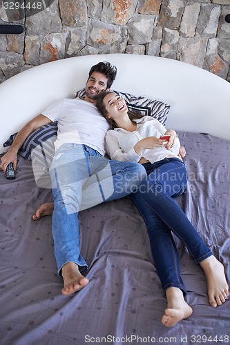 Image of couple relax and have fun in bed