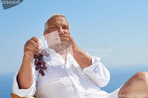 Image of senior man sitting outside