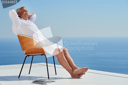 Image of senior man sitting outside