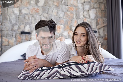 Image of couple relax and have fun in bed