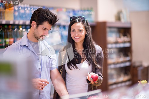 Image of couple shopping in a supermarket