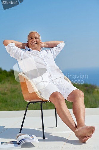 Image of senior man sitting outside