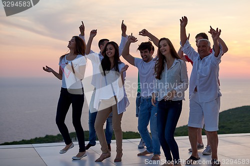 Image of party people  on sunset