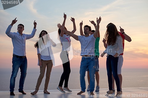 Image of party people  on sunset