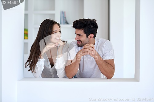 Image of relaxed young couple at home staircase