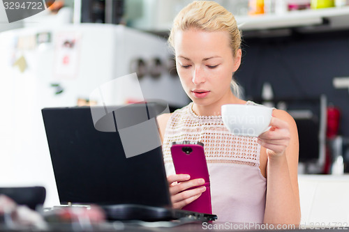 Image of Business woman working from home.