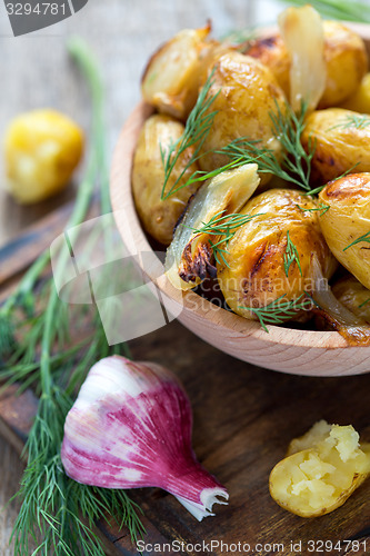 Image of Baked potatoes, dill and garlic.