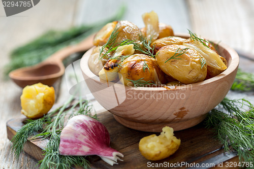 Image of Baked potatoes with fresh dill.