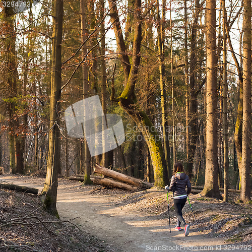 Image of Woman hiking in nature. 