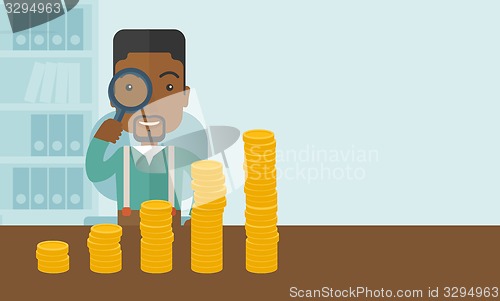 Image of Black man looking at his growing business using magnifying glass.