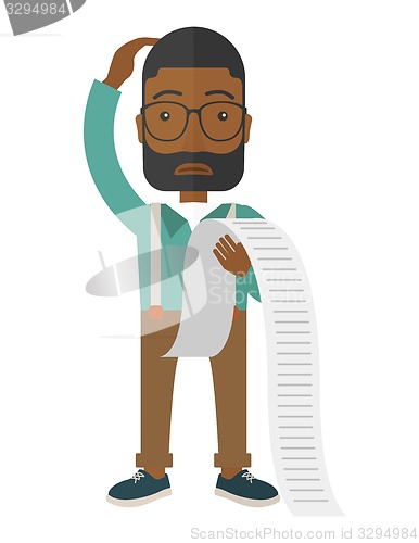 Image of Sad african-american employee holding a list of payables.