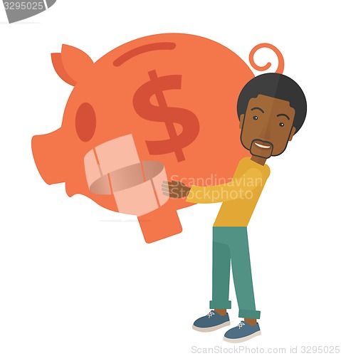Image of African businessman carries a big piggy bank for saving money.