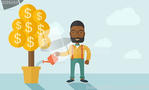 Image of African businessman happily watering the money tree.