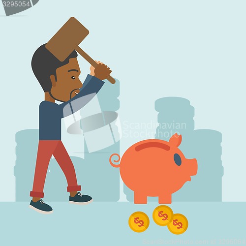 Image of Black guy holding a hammer breaking piggy bank.