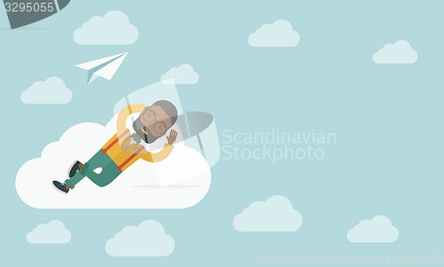 Image of Black man lying on a cloud with paper plane.