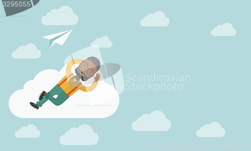 Image of Black man lying on a cloud with paper plane.