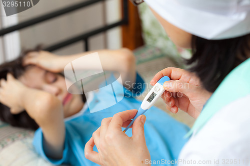 Image of digital thermometer in the hands of a doctor. Temperature measur