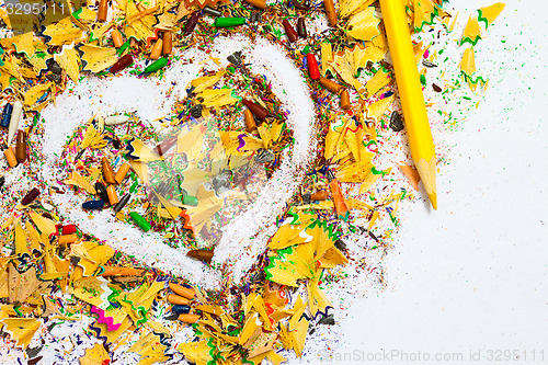 Image of heart, yellow pencil and wood shavings