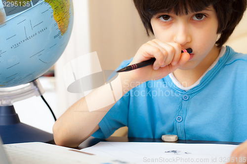 Image of boy doing homework