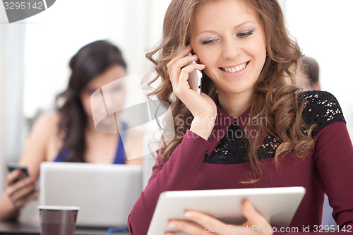 Image of smiling young girl talking on the phone