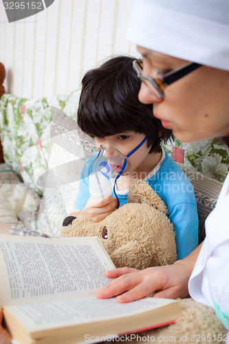 Image of family doctor makes the child inhalation