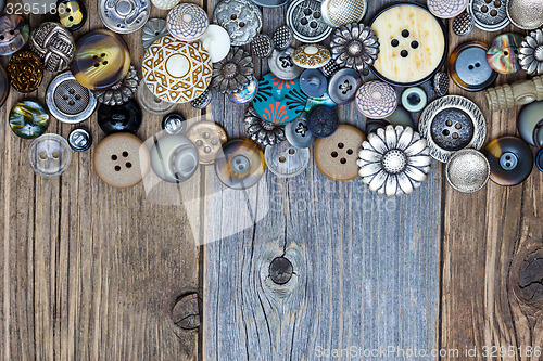 Image of intage buttons on aged boards surface