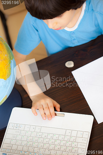 Image of boy doing homework