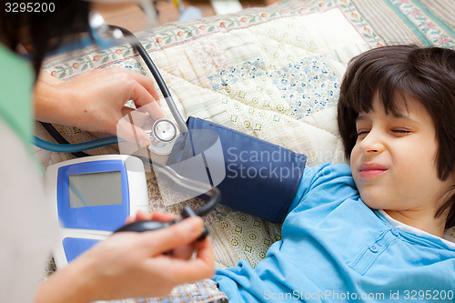 Image of Doctor pediatrician measure blood pressure