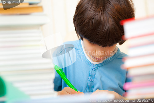 Image of schoolboy doing homework